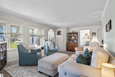 This four bedroom house with a double lot checks all the boxes on Elk Rapids Golf Club in Michigan - for sale on GolfHomes.com, golf home, golf lot