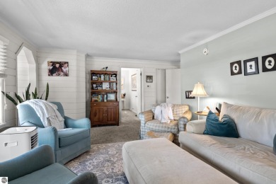 This four bedroom house with a double lot checks all the boxes on Elk Rapids Golf Club in Michigan - for sale on GolfHomes.com, golf home, golf lot