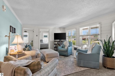This four bedroom house with a double lot checks all the boxes on Elk Rapids Golf Club in Michigan - for sale on GolfHomes.com, golf home, golf lot