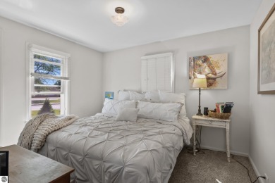 This four bedroom house with a double lot checks all the boxes on Elk Rapids Golf Club in Michigan - for sale on GolfHomes.com, golf home, golf lot