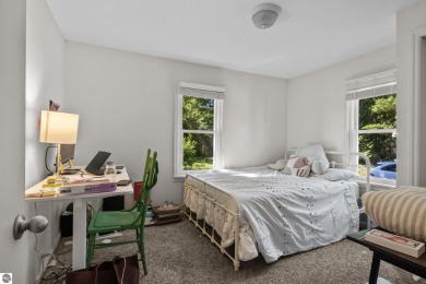 This four bedroom house with a double lot checks all the boxes on Elk Rapids Golf Club in Michigan - for sale on GolfHomes.com, golf home, golf lot