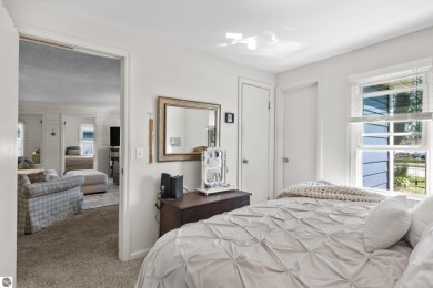This four bedroom house with a double lot checks all the boxes on Elk Rapids Golf Club in Michigan - for sale on GolfHomes.com, golf home, golf lot