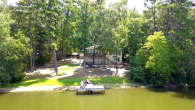 WATERFRONT RETREAT ON PINEYWOODS LAKE for sale on GolfHomes.com
