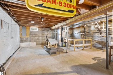 This four bedroom house with a double lot checks all the boxes on Elk Rapids Golf Club in Michigan - for sale on GolfHomes.com, golf home, golf lot
