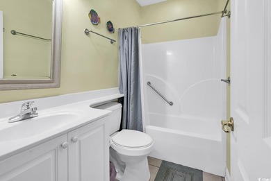 Welcome to this spacious and inviting three-bedroom, two-bath on Tupelo Bay Golf Complex  in South Carolina - for sale on GolfHomes.com, golf home, golf lot