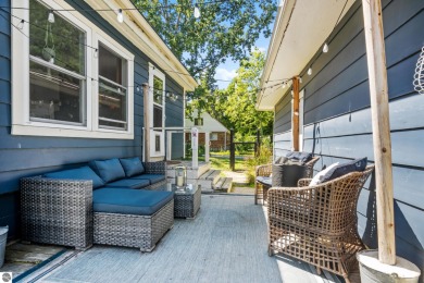 This four bedroom house with a double lot checks all the boxes on Elk Rapids Golf Club in Michigan - for sale on GolfHomes.com, golf home, golf lot