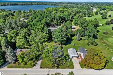 This four bedroom house with a double lot checks all the boxes on Elk Rapids Golf Club in Michigan - for sale on GolfHomes.com, golf home, golf lot