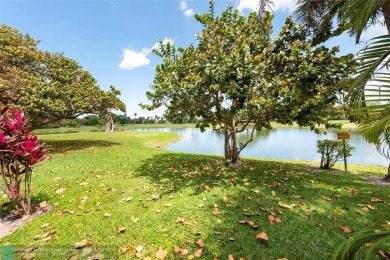 RARELY AVAILABLE VILLA OFFERING A CONTEMPORARY FEEL AND on Palm-Aire Country Club and Resort - The Oaks in Florida - for sale on GolfHomes.com, golf home, golf lot