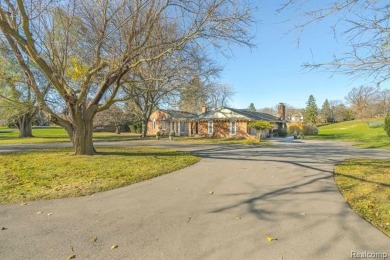 Experience resort-style living with serene, year-round views of on Forest Lake Country Club in Michigan - for sale on GolfHomes.com, golf home, golf lot