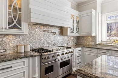 An extraordinary expression of refined luxury and warmth, this on TPC At Sugarloaf Golf Club in Georgia - for sale on GolfHomes.com, golf home, golf lot