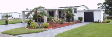 When entering this gorgeous 2-bedroom, 2-bath Palm Harbor Home on Schalamar Creek Golf and Country Club in Florida - for sale on GolfHomes.com, golf home, golf lot