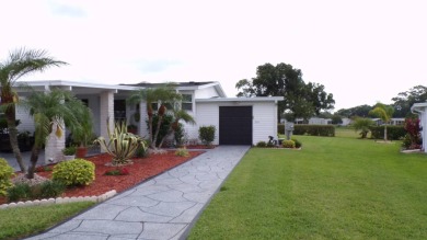 When entering this gorgeous 2-bedroom, 2-bath Palm Harbor Home on Schalamar Creek Golf and Country Club in Florida - for sale on GolfHomes.com, golf home, golf lot