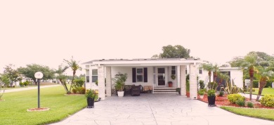 When entering this gorgeous 2-bedroom, 2-bath Palm Harbor Home on Schalamar Creek Golf and Country Club in Florida - for sale on GolfHomes.com, golf home, golf lot