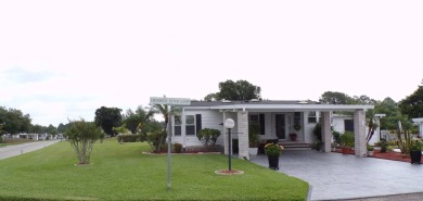When entering this gorgeous 2-bedroom, 2-bath Palm Harbor Home on Schalamar Creek Golf and Country Club in Florida - for sale on GolfHomes.com, golf home, golf lot