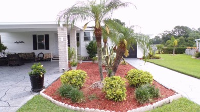 When entering this gorgeous 2-bedroom, 2-bath Palm Harbor Home on Schalamar Creek Golf and Country Club in Florida - for sale on GolfHomes.com, golf home, golf lot