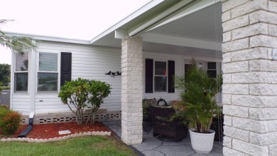 When entering this gorgeous 2-bedroom, 2-bath Palm Harbor Home on Schalamar Creek Golf and Country Club in Florida - for sale on GolfHomes.com, golf home, golf lot
