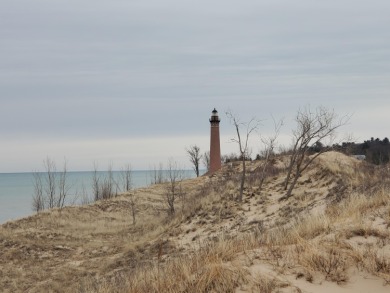 Tucked between Silver Lake and Stony Lake and just minutes from on Benona Shores Golf Course in Michigan - for sale on GolfHomes.com, golf home, golf lot