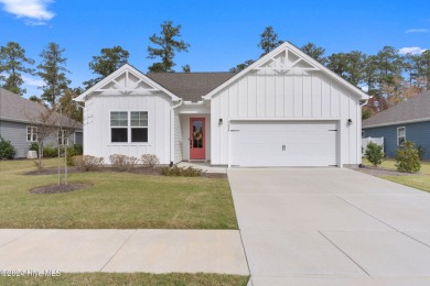 Nestled in the highly sought-after Brunswick Forest community on Cape Fear National At Brunswick Forest in North Carolina - for sale on GolfHomes.com, golf home, golf lot