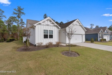 Nestled in the highly sought-after Brunswick Forest community on Cape Fear National At Brunswick Forest in North Carolina - for sale on GolfHomes.com, golf home, golf lot