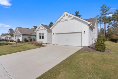 Nestled in the highly sought-after Brunswick Forest community on Cape Fear National At Brunswick Forest in North Carolina - for sale on GolfHomes.com, golf home, golf lot