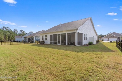 Nestled in the highly sought-after Brunswick Forest community on Cape Fear National At Brunswick Forest in North Carolina - for sale on GolfHomes.com, golf home, golf lot