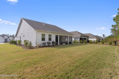 Nestled in the highly sought-after Brunswick Forest community on Cape Fear National At Brunswick Forest in North Carolina - for sale on GolfHomes.com, golf home, golf lot