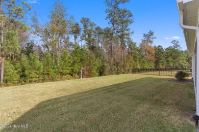 Nestled in the highly sought-after Brunswick Forest community on Cape Fear National At Brunswick Forest in North Carolina - for sale on GolfHomes.com, golf home, golf lot