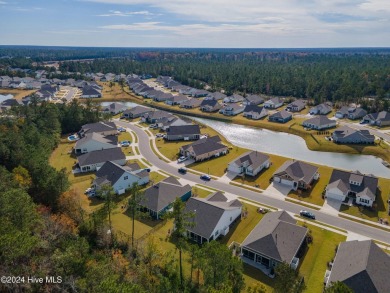 Nestled in the highly sought-after Brunswick Forest community on Cape Fear National At Brunswick Forest in North Carolina - for sale on GolfHomes.com, golf home, golf lot