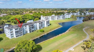 TOP FLOOR PENTHOUSE WITH A PANORAMIC LAKE & GOLF VIEW.  LONG on Oriole Golf and Tennis Club in Florida - for sale on GolfHomes.com, golf home, golf lot