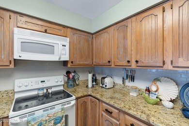 This cozy 2 bedroom 2 bath condo is nestled right on Brick on Brick Landing Plantation Yacht and Golf Club in North Carolina - for sale on GolfHomes.com, golf home, golf lot