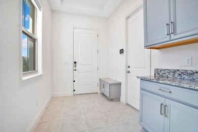 One or more photo(s) has been virtually staged. Built in 2023 on Eagle Creek Golf Club in Florida - for sale on GolfHomes.com, golf home, golf lot