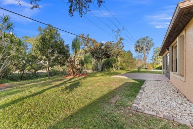 This beautiful CBS home offers the perfect blend of modern on Spanish Lakes I in Florida - for sale on GolfHomes.com, golf home, golf lot