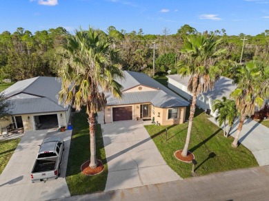 This beautiful CBS home offers the perfect blend of modern on Spanish Lakes I in Florida - for sale on GolfHomes.com, golf home, golf lot