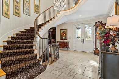 Stunning European-inspired home on Loch Lloyd's iconic 18th hole on Loch Lloyd Country Club in Missouri - for sale on GolfHomes.com, golf home, golf lot