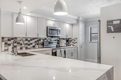 Welcome to 12926 Briarlake Dr #201 - a beautifully updated on Old Marsh Golf Club in Florida - for sale on GolfHomes.com, golf home, golf lot