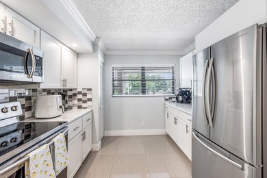 Welcome to 12926 Briarlake Dr #201 - a beautifully updated on Old Marsh Golf Club in Florida - for sale on GolfHomes.com, golf home, golf lot