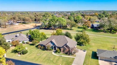 This custom brick & stone home sits on the #11 tee box and has on Lake Kiowa Golf Course in Texas - for sale on GolfHomes.com, golf home, golf lot