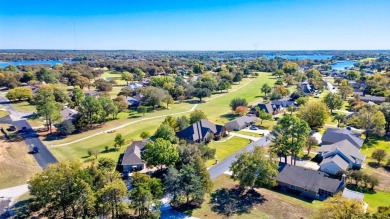 This custom brick & stone home sits on the #11 tee box and has on Lake Kiowa Golf Course in Texas - for sale on GolfHomes.com, golf home, golf lot