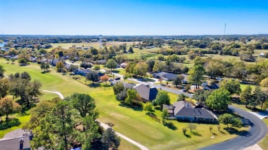 This custom brick & stone home sits on the #11 tee box and has on Lake Kiowa Golf Course in Texas - for sale on GolfHomes.com, golf home, golf lot