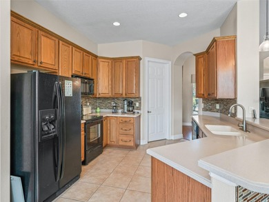 Welcome home! 8 ft doors, arched doorways, rounded corners, and on Harbor Hills Country Club in Florida - for sale on GolfHomes.com, golf home, golf lot