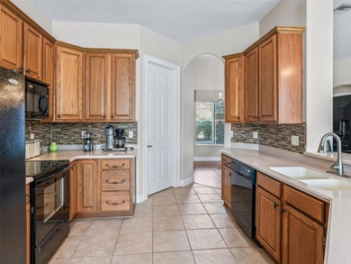 Welcome home! 8 ft doors, arched doorways, rounded corners, and on Harbor Hills Country Club in Florida - for sale on GolfHomes.com, golf home, golf lot