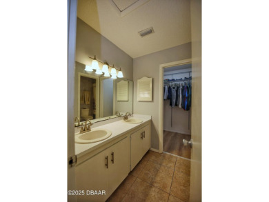 Nestled in the highly sought-after Sugar Mill Golf Townhomes on Sugar Mill Country Club in Florida - for sale on GolfHomes.com, golf home, golf lot