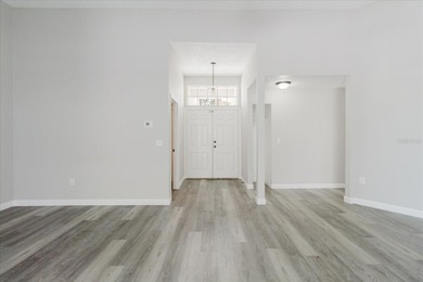 Short Sale. Step into this stunning split-floor plan residence on Tarpon Springs Golf Course in Florida - for sale on GolfHomes.com, golf home, golf lot