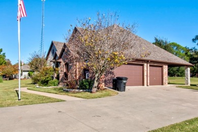 This custom brick & stone home sits on the #11 tee box and has on Lake Kiowa Golf Course in Texas - for sale on GolfHomes.com, golf home, golf lot