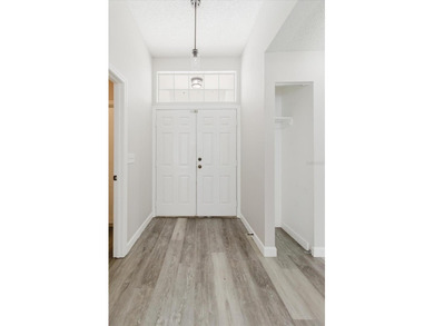 Short Sale. Step into this stunning split-floor plan residence on Tarpon Springs Golf Course in Florida - for sale on GolfHomes.com, golf home, golf lot