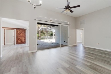 Short Sale. Step into this stunning split-floor plan residence on Tarpon Springs Golf Course in Florida - for sale on GolfHomes.com, golf home, golf lot