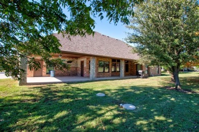 This custom brick & stone home sits on the #11 tee box and has on Lake Kiowa Golf Course in Texas - for sale on GolfHomes.com, golf home, golf lot