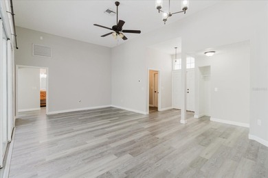 Short Sale. Step into this stunning split-floor plan residence on Tarpon Springs Golf Course in Florida - for sale on GolfHomes.com, golf home, golf lot