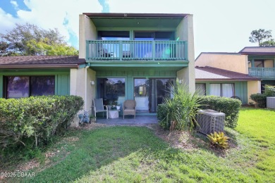 Nestled in the highly sought-after Sugar Mill Golf Townhomes on Sugar Mill Country Club in Florida - for sale on GolfHomes.com, golf home, golf lot