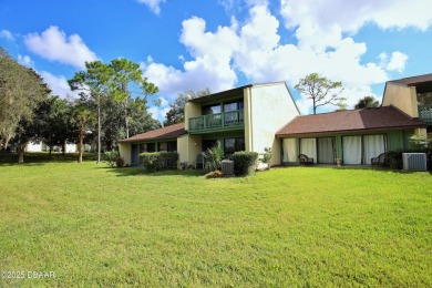 Nestled in the highly sought-after Sugar Mill Golf Townhomes on Sugar Mill Country Club in Florida - for sale on GolfHomes.com, golf home, golf lot